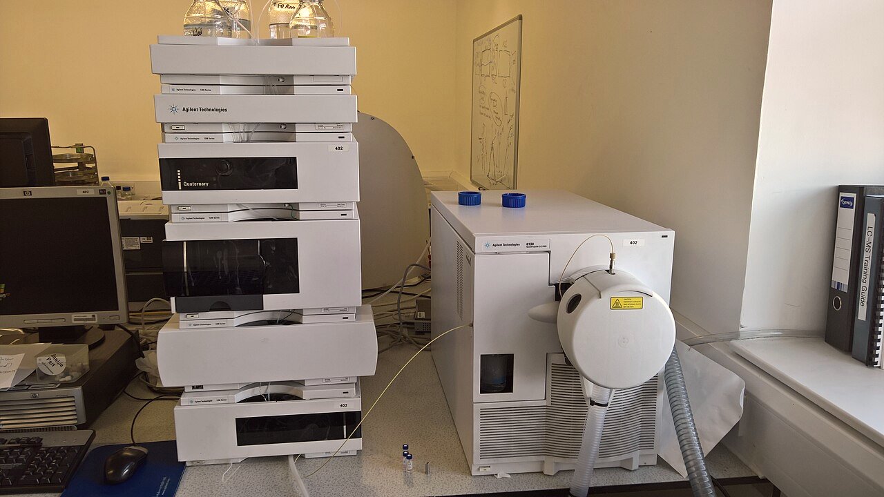 Agilent 1200 series HPLC stack beside a 6130 single-quadrupole mass spectrometer in a laboratory.